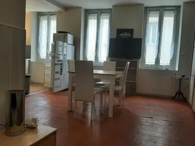 a kitchen with a table and chairs in a room at Studio Narbonne in Narbonne