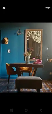 a table with a mirror and a chair in a room at Big Sur Room in Carcassonne
