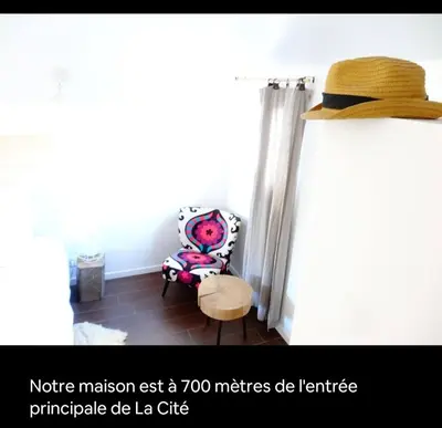 a hat sitting in a room with a chair at Big Sur Room in Carcassonne