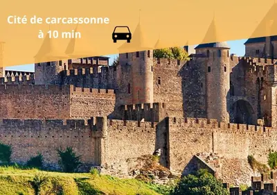 a picture of a castle with a car on it at L'écrin Carcassonnais- parking gratuit- Terrasse in Carcassonne