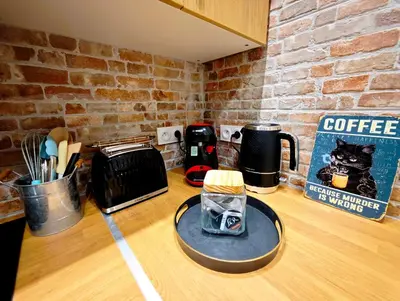 a counter top with a coffee maker on a table at Le Central Limouxin - Rénové avec balcon - 6 pers in Limoux