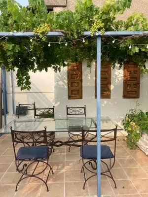 a living room with a couch and a table at Gîte de l'oiseau bleu in Lautrec
