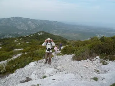 a person standing on a mountain taking a picture at Le Refuge des Garrigues in Fraissé-des-Corbières