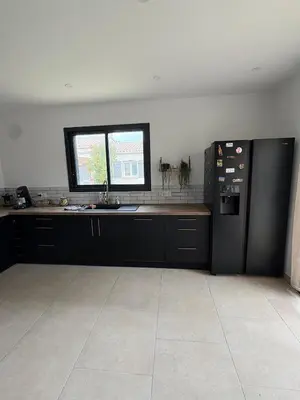 a kitchen with a sink and a counter at Maison- Aude in Cuxac-dʼAude