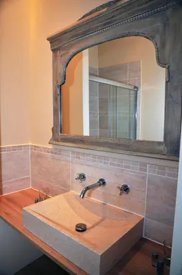 a bathroom with a sink and a mirror at Maison Matisse in Saint-Nazaire-dʼAude