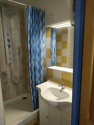 a bathroom with a sink and a shower at Domaine Vents Du Sud in Vingrau