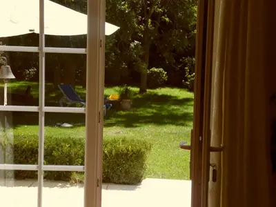 an open door with a view of a yard at Gîte Belfloret in Renneville