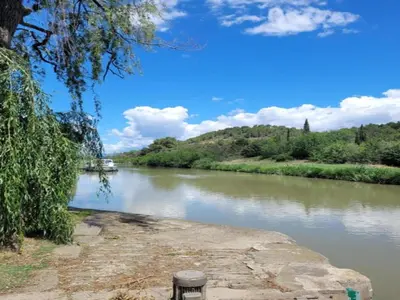 a view of a river with a boat on it at Holiday Home in Félines-Minervois with Pool in Félines-Minervois