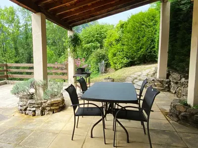 a table and chairs sitting on a patio at Gite de Serrelongue in Montségur