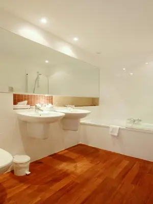 a bathroom with two sinks and a tub and a toilet at Château de la Prade in Bram