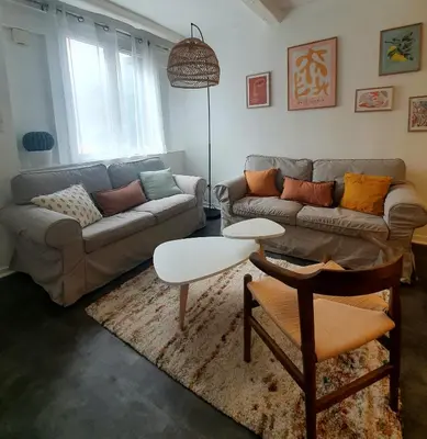 a living room with a couch and a table at La Caponnière in Carcassonne