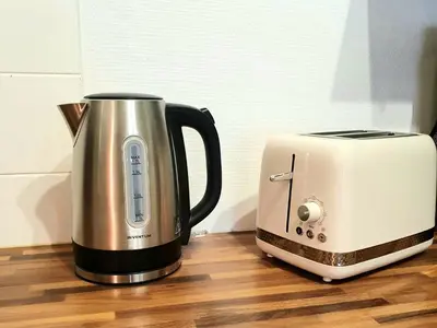 a coffee maker and a toaster sitting on a counter at La Caponnière in Carcassonne
