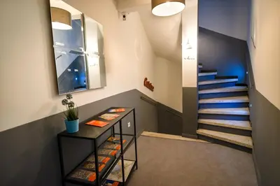 a staircase in a room with a stair case at La Maison Gustave in Narbonne