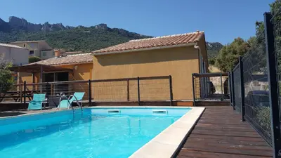 a swimming pool next to a house at Etape Cathare in Duilhac