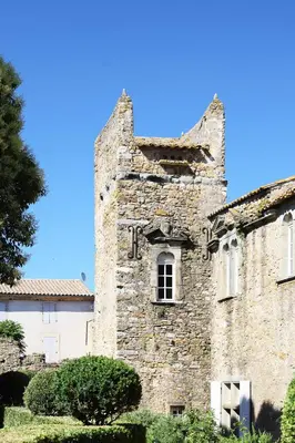 an old stone building with a tower at Château d'Agel gite in Agel