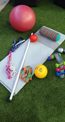 a table with a frisbee and other items on the grass at Chouette coquette in Salses-le-Chateau