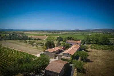 an aerial view of a vineyard and a building in a field at Les Fenals in Fitou
