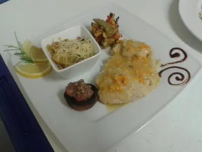 a plate of food on a table with food at Le Baudilois in Pont-de-Larn