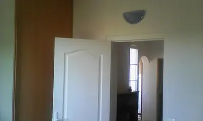 a room with a white door and a window at Apartment Albert parking privé gratuit in Limoux