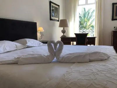 a bed with two hearts made out of towels at Le Jardin d'Homps in Homps