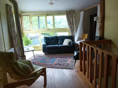 a living room with a couch and a window at Gite Sent Martin in Roquefixade