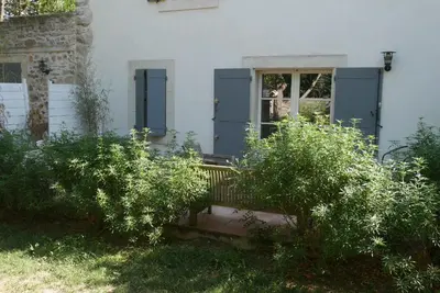 a house with a blue door and a window at C&O Appartements in Comigne