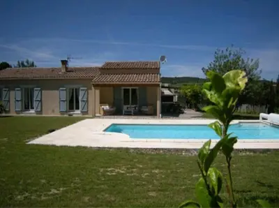 a house with a swimming pool in front of a house at Gite Quatre Saisons 2 in Limoux