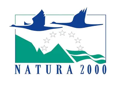 two birds flying over the mountains logo at Gîte rural La Bergerie du Sant in Massaguel