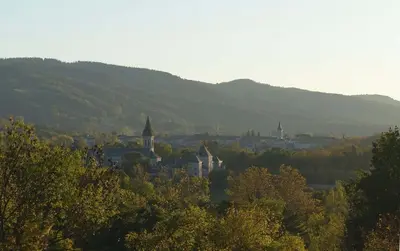 a view of a city with mountains in the background at Gîte rural La Bergerie du Sant in Massaguel