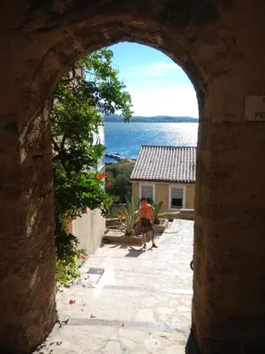 a man walking through an archway of a building at Fisherman's View in Bages