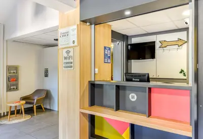 a view of a reception desk in a room at B&B HOTEL Narbonne 1 in Narbonne