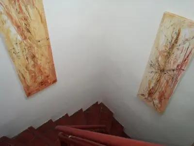 two paintings hanging on the wall of a theatre at Appartements Cote pont Vieux-Self Check-In in Carcassonne