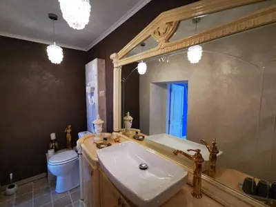 a bathroom with a sink and a toilet and a mirror at Château de Verdalle in Verdalle