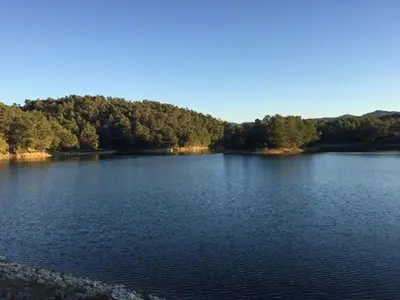 a large body of water with trees in the background at Nina in Carcassonne