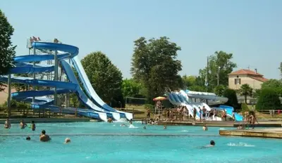 a water park with people in the water and slides at Nina in Carcassonne