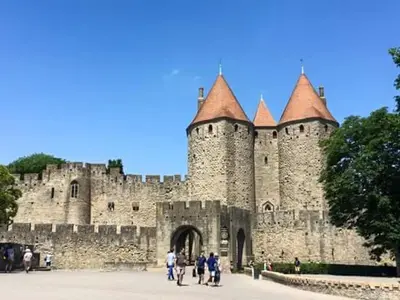 a castle with people standing in front of it at Nina in Carcassonne