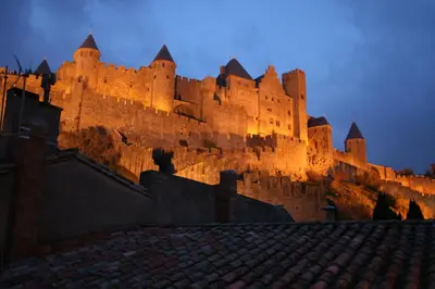 a large castle is lit up at dusk at Cammas de Bas in Montréal