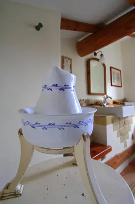 a hat sitting on a stand in a room at Cuq en Terrasses in Cuq-Toulza