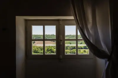 an open window with a view of a field at Cuq en Terrasses in Cuq-Toulza
