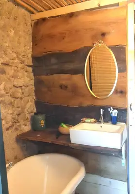 a bathroom with a sink and a mirror at Maison de campagne avec vue sur la montagne à Puivert. in Puivert