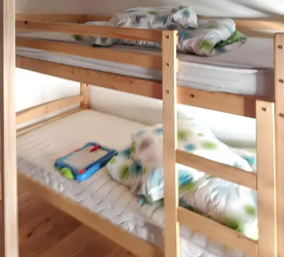 a bunk bed with a toy car on the bottom bunk at Maison de campagne avec vue sur la montagne à Puivert. in Puivert