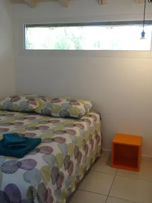 a bedroom with a bed and a window at Le Moulin de l'Abbé in Sorèze
