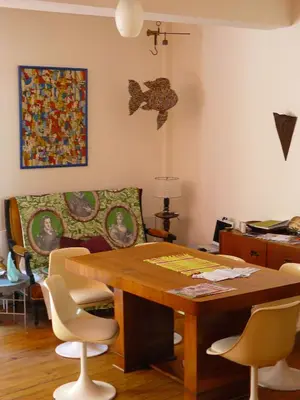 a dining room with a wooden table and chairs at Nidélice Chambre d'hôtes in Quillan