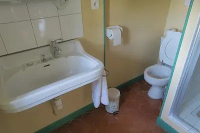 a bathroom with a sink and a toilet at Le Domaine de Fraissinet in Ouveillan