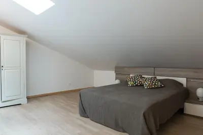 a bedroom with a bed with two pillows on it at La Maison des Vendangeurs sur Mer in Gruissan