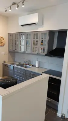 a kitchen with a sink and a stove at Gites de Gabrielle in Capestang