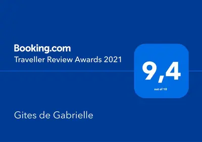 a blue cylinder with the words travel review awards on it at Gites de Gabrielle in Capestang