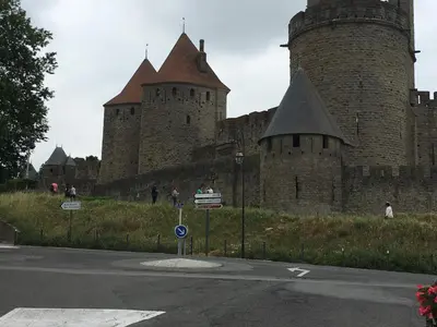 a large castle with two towers on the side of a road at Appartements 