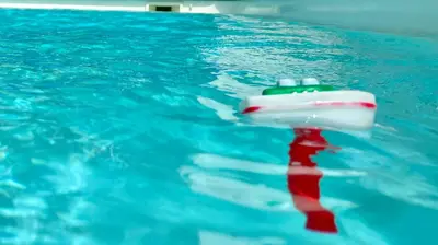 a red and white object in a swimming pool at Aux Belles Vacances - ADULTS ONLY in Caux-et-Sauzens