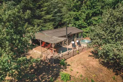 an overhead view of a house in the woods at Domaine de la Vitarelle Glamping in Villanière